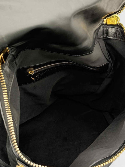 Pre - loved GUISEPPE ZANOTTI Black & Gold Flower Backpack at Reems Closet