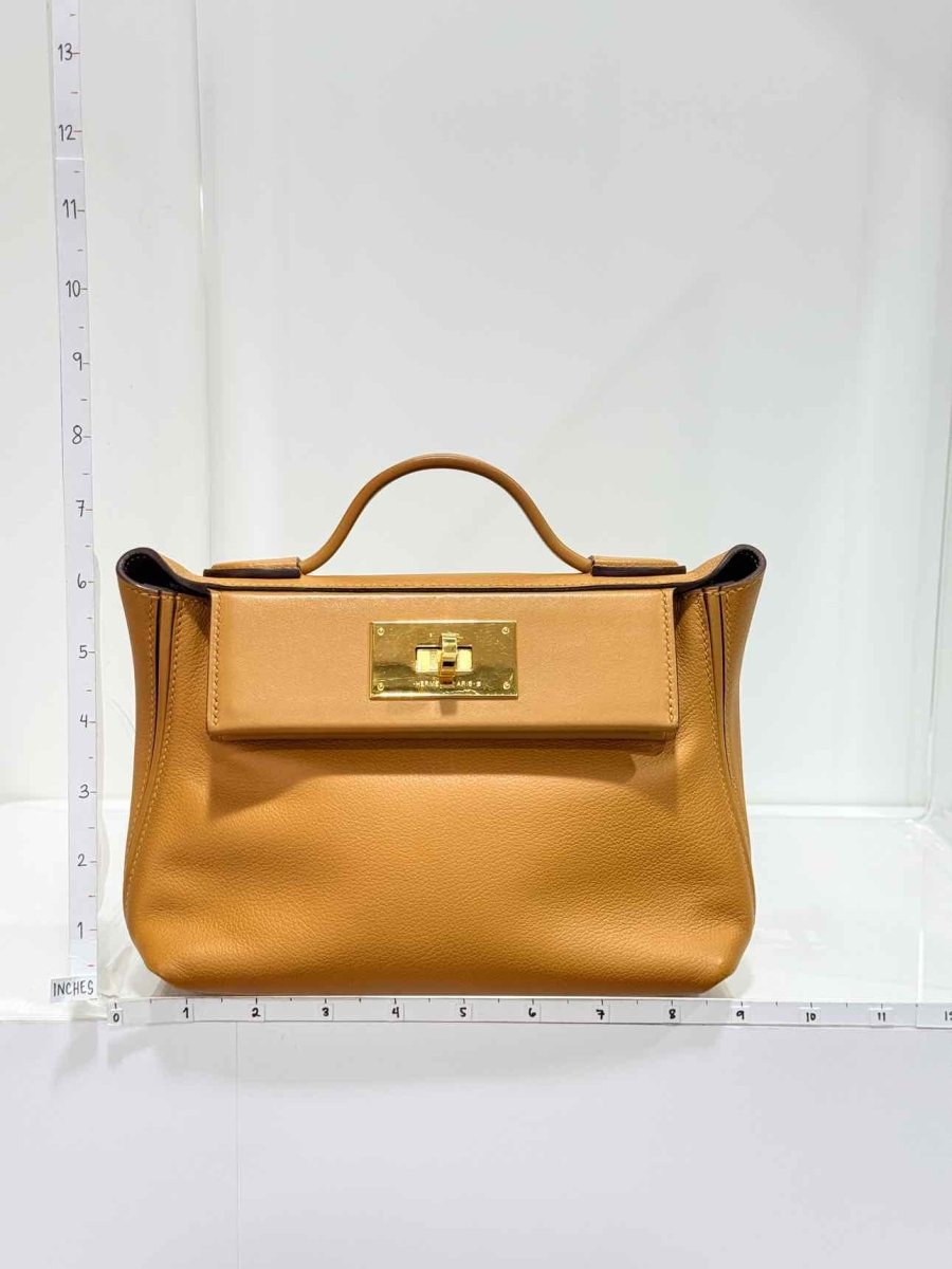 Pre-loved HERMES 24/24 Gold Top Handle at Reems Closet