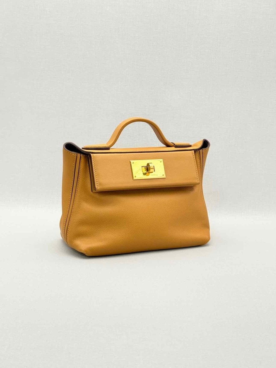 Pre-loved HERMES 24/24 Gold Top Handle at Reems Closet