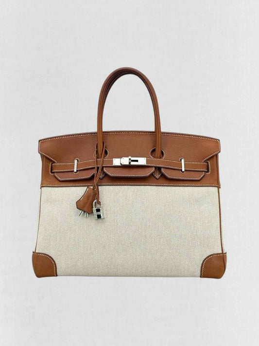 Pre - loved HERMES Birkin Cream & Brown Top Handle at Reems Closet