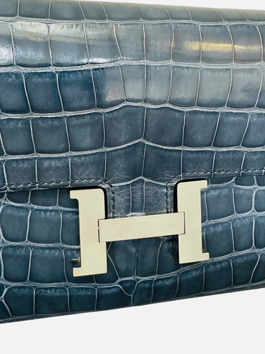 Pre - loved HERMES Constance Blue Continental Wallet at Reems Closet