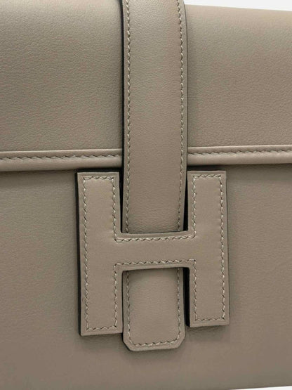 Pre - loved HERMES Jige Elan 29 Grey Clutch at Reems Closet