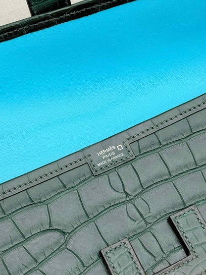Pre-loved HERMES Jige Elan Vert Emerald Clutch at Reems Closet