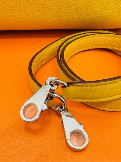 Pre - loved HERMES Kelly Jaune Citron Top Handle at Reems Closet