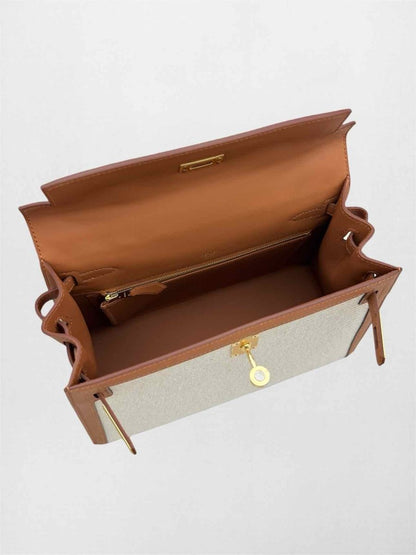 Pre-loved HERMES Kelly Sellier Ecru Gold Top Handle at Reems Closet