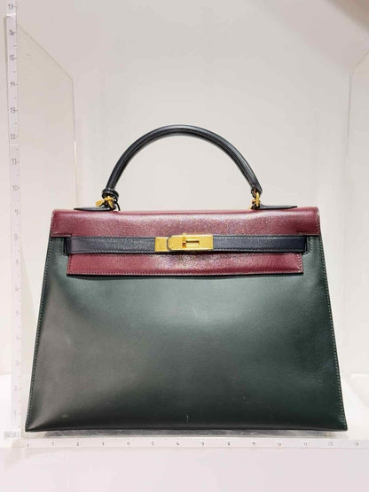 Pre-loved HERMES Vert Fonce, Rouge H, Blue Marine Top Handle at Reems Closet