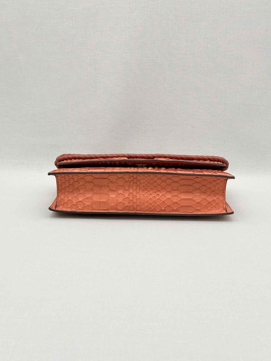 Pre-loved KNEED Coco Orange Clutch at Reems Closet