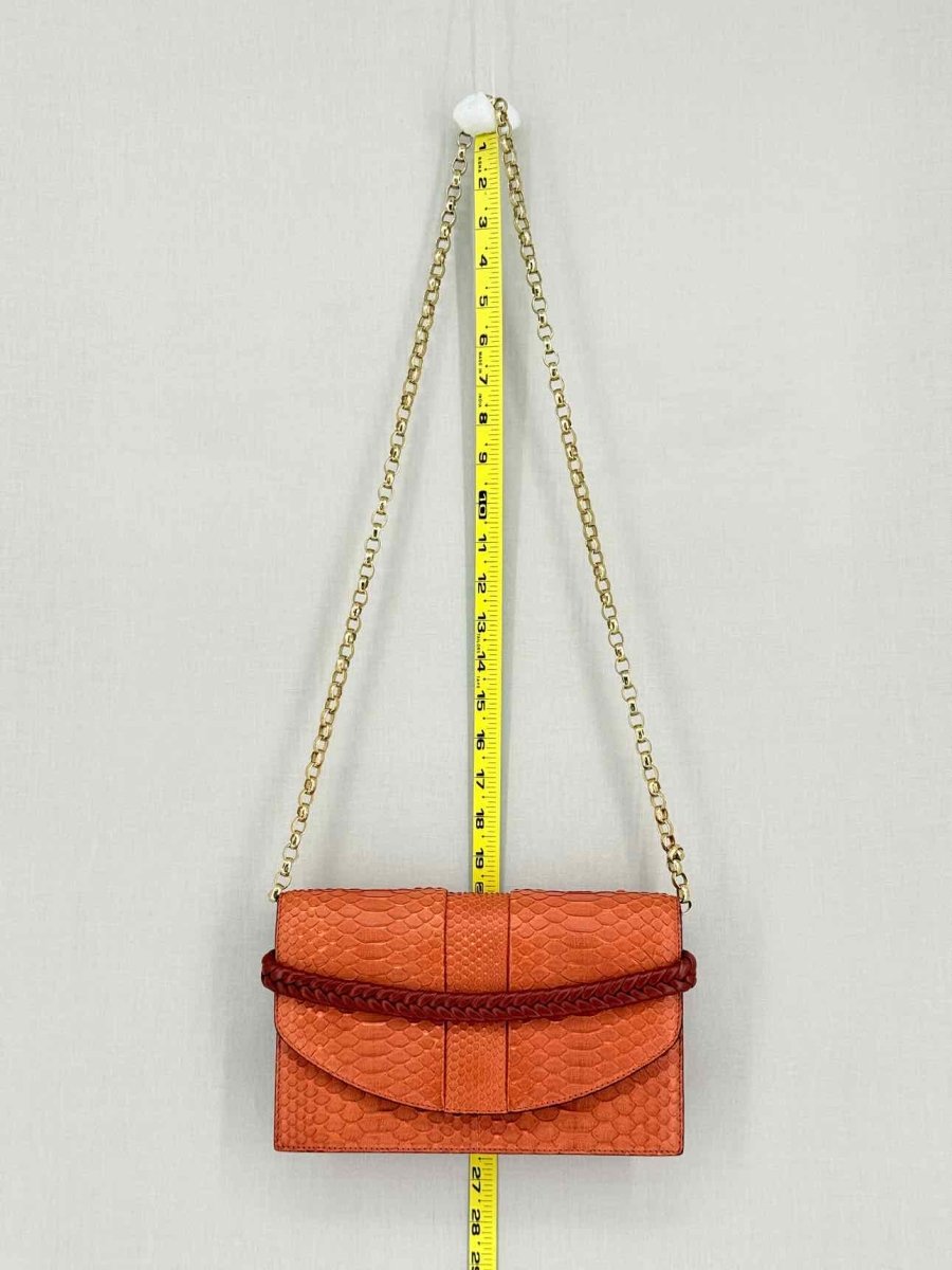 Pre-loved KNEED Coco Orange Clutch at Reems Closet