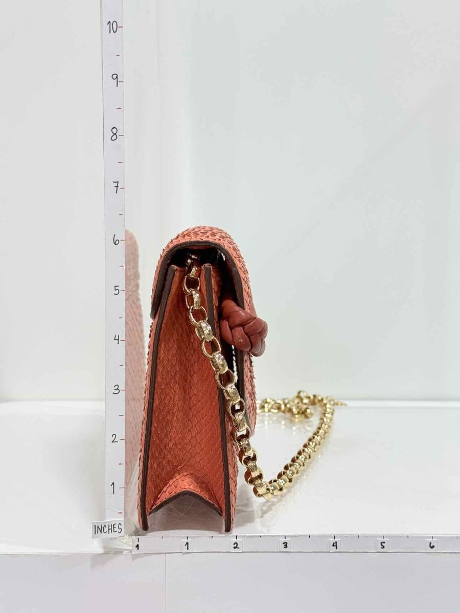 Pre-loved KNEED Coco Orange Clutch at Reems Closet