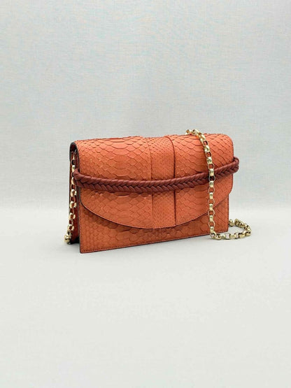 Pre-loved KNEED Coco Orange Clutch at Reems Closet