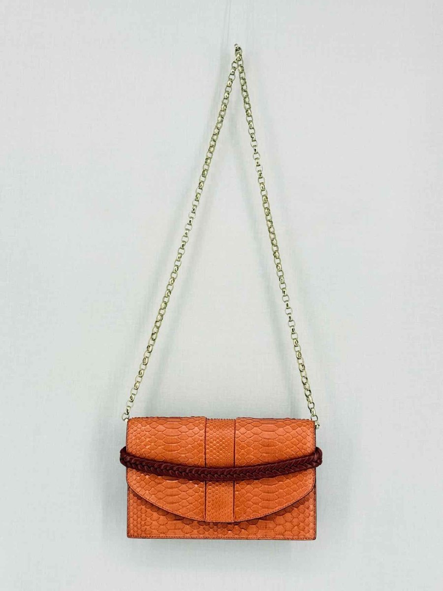 Pre-loved KNEED Coco Orange Clutch at Reems Closet