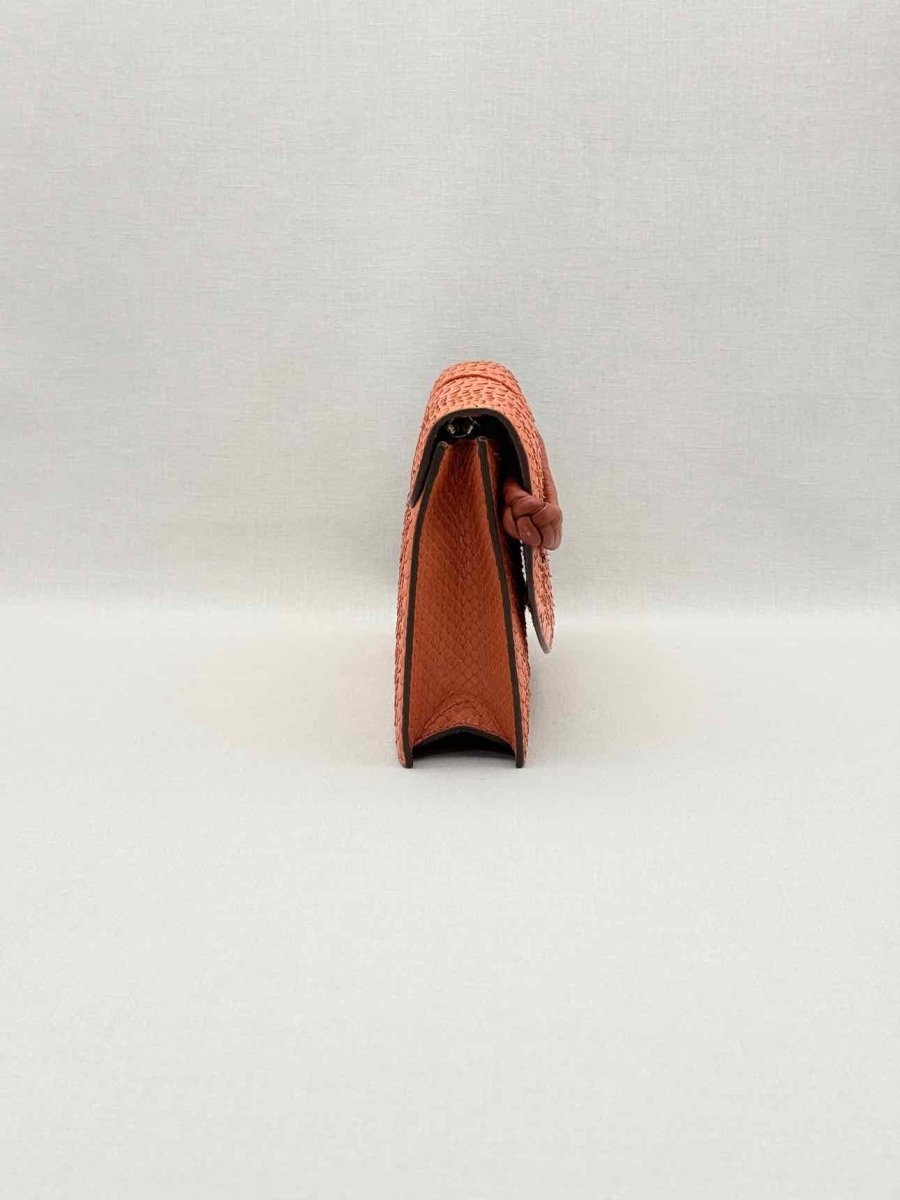 Pre-loved KNEED Coco Orange Clutch at Reems Closet