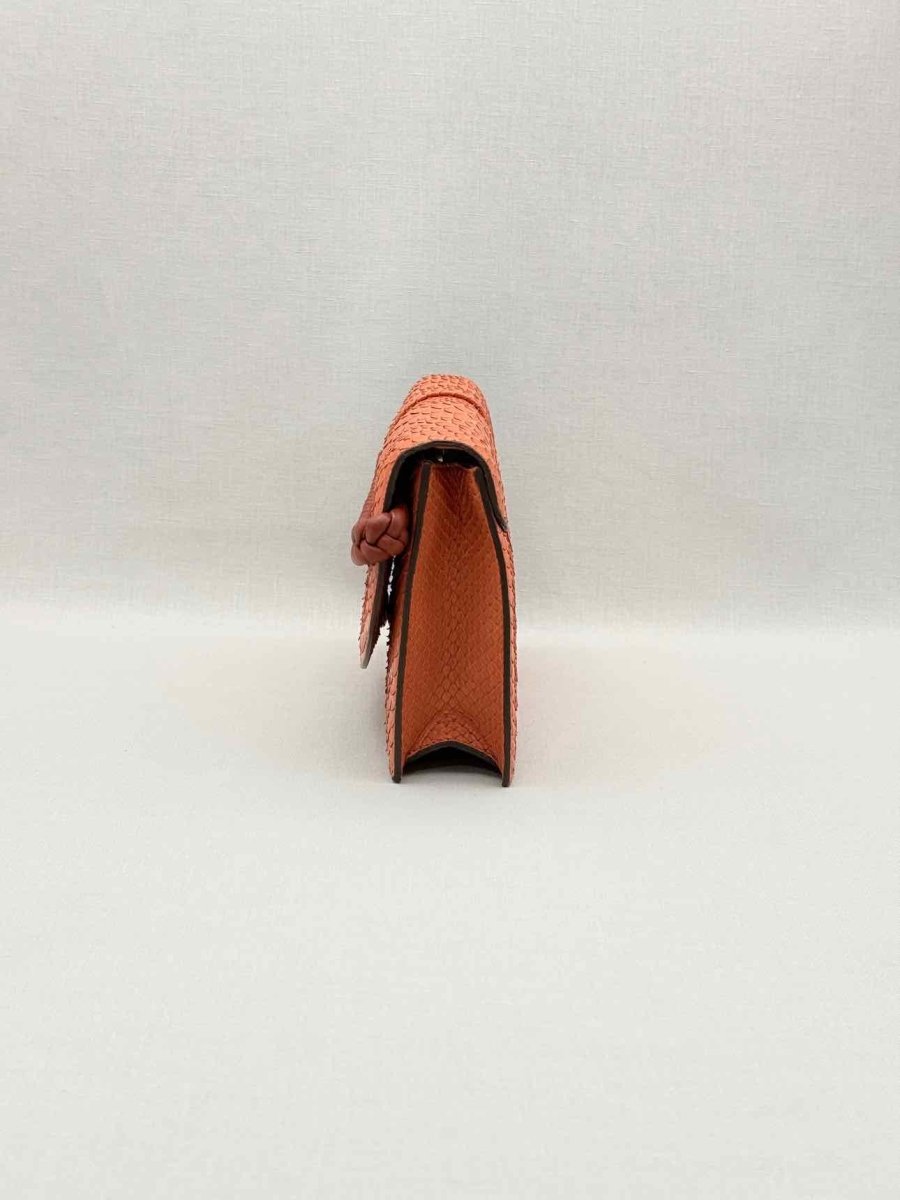 Pre-loved KNEED Coco Orange Clutch at Reems Closet