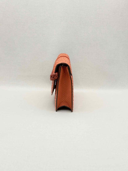 Pre-loved KNEED Coco Orange Clutch at Reems Closet