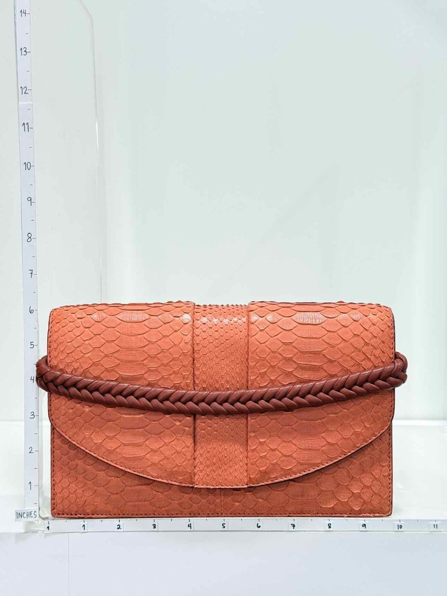Pre-loved KNEED Coco Orange Clutch at Reems Closet