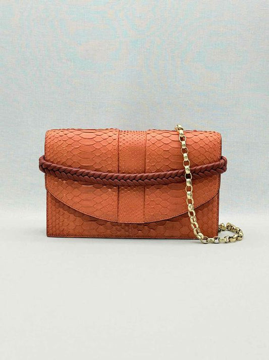 Pre-loved KNEED Coco Orange Clutch at Reems Closet