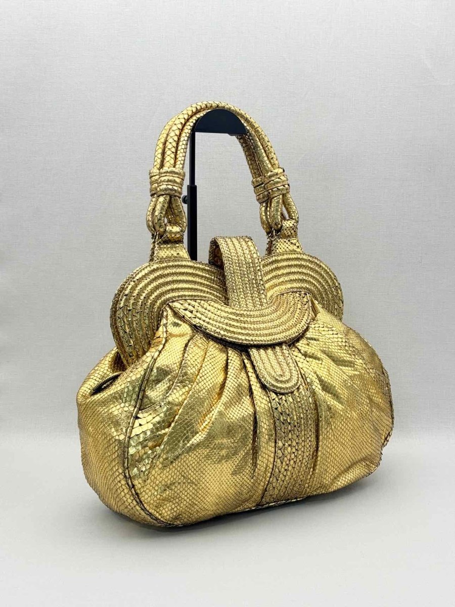 Pre-loved LARA BOHINC Lunar Eclipse Metallic Gold Top Handle at Reems Closet