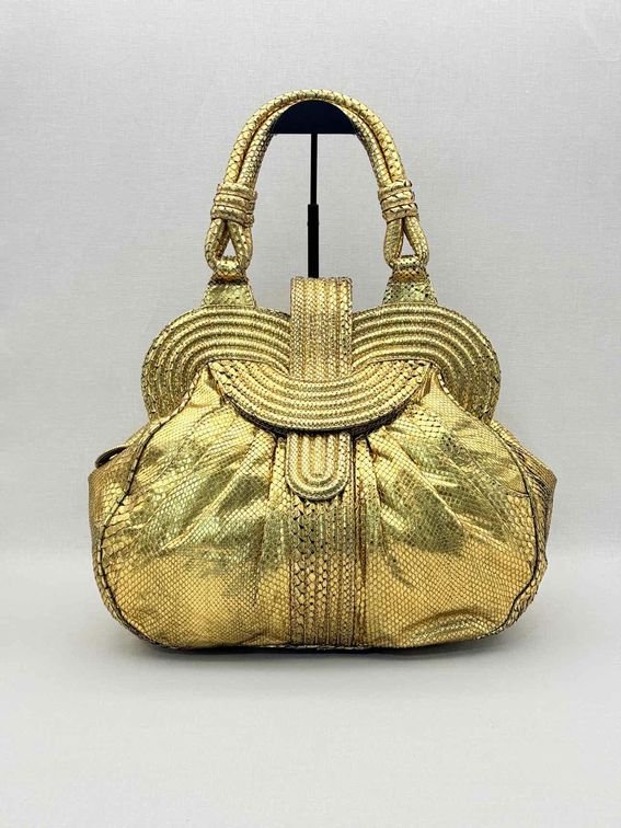 Pre-loved LARA BOHINC Lunar Eclipse Metallic Gold Top Handle at Reems Closet