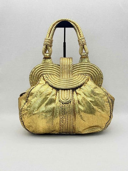 Pre-loved LARA BOHINC Lunar Eclipse Metallic Gold Top Handle at Reems Closet
