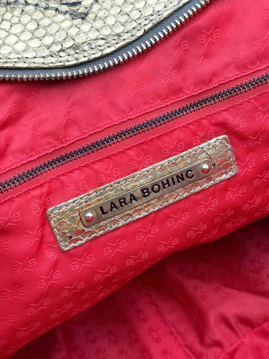 Pre-loved LARA BOHINC Lunar Eclipse Metallic Gold Top Handle at Reems Closet