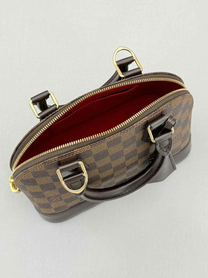 Pre - loved LOUIS VUITTON Alma Brown Damier Ebene Top Handle at Reems Closet