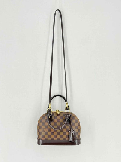 Pre - loved LOUIS VUITTON Alma Brown Damier Ebene Top Handle at Reems Closet