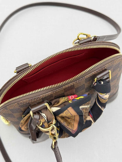 Pre - loved LOUIS VUITTON Alma Brown Damier Ebene Top Handle at Reems Closet