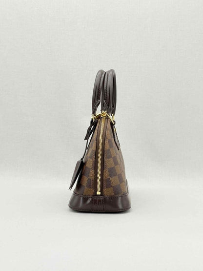 Pre - loved LOUIS VUITTON Alma Brown Damier Ebene Top Handle at Reems Closet