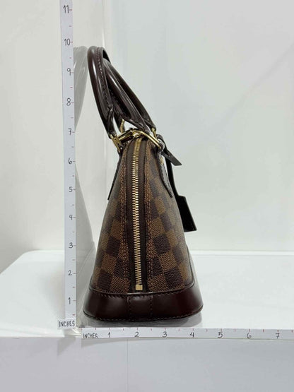 Pre - loved LOUIS VUITTON Alma Brown Damier Ebene Top Handle at Reems Closet