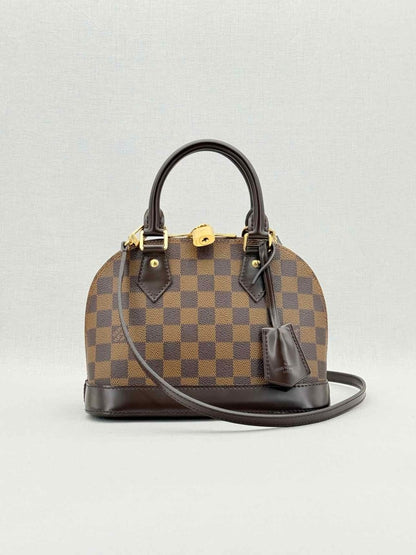 Pre - loved LOUIS VUITTON Alma Brown Damier Ebene Top Handle at Reems Closet