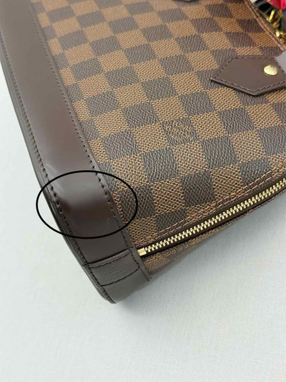 Pre - loved LOUIS VUITTON Alma Brown Damier Ebene Top Handle at Reems Closet