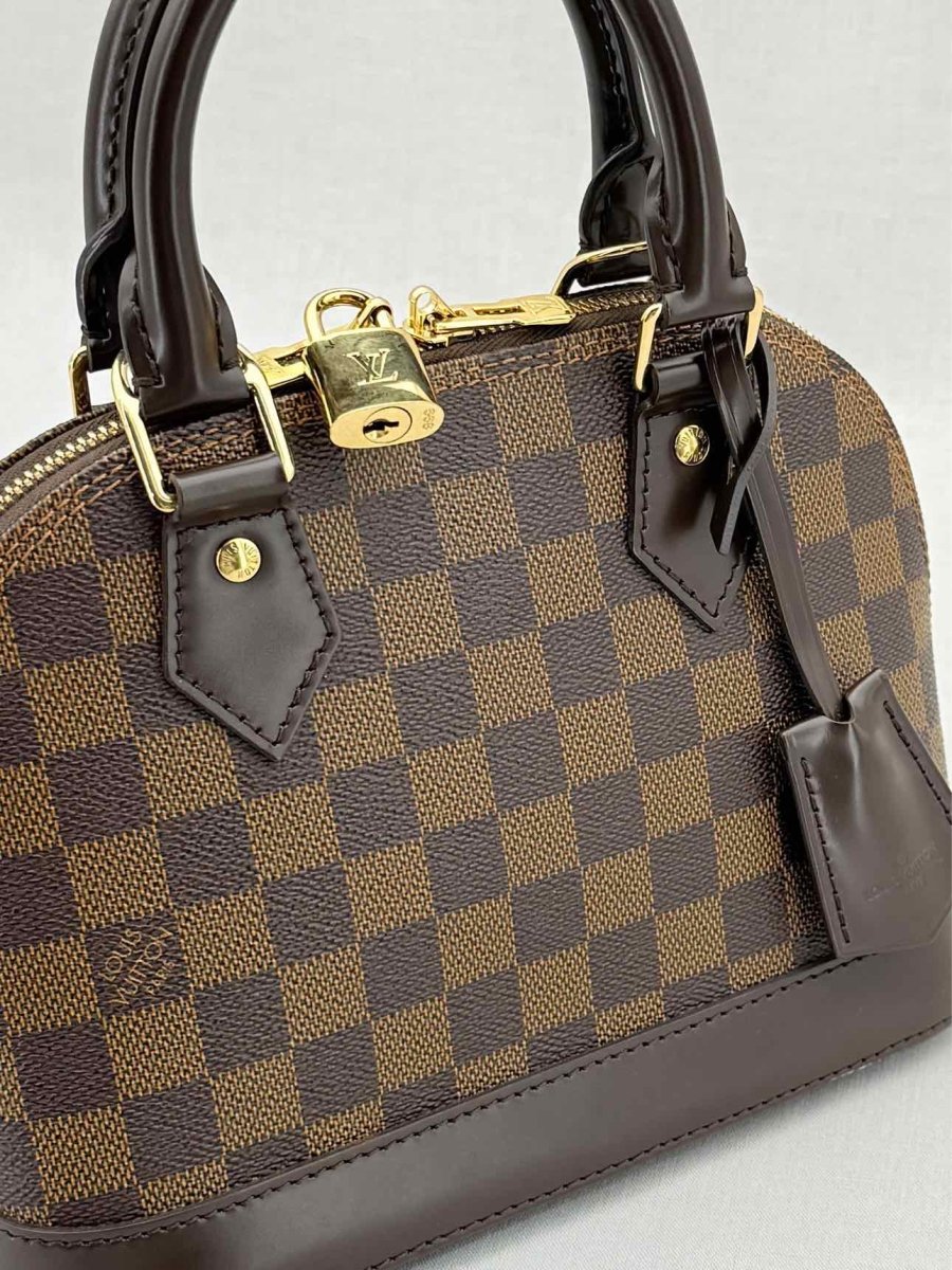 Pre - loved LOUIS VUITTON Alma Brown Damier Ebene Top Handle at Reems Closet