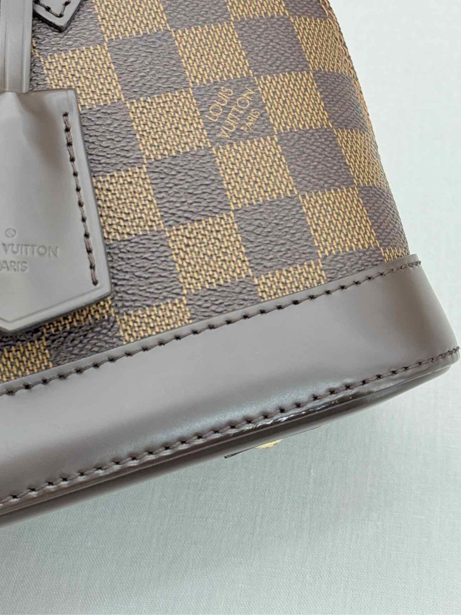 Pre - loved LOUIS VUITTON Alma Brown Damier Ebene Top Handle at Reems Closet