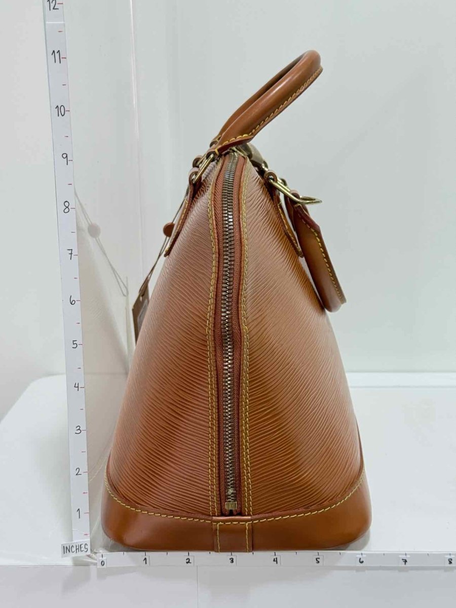 Pre - loved LOUIS VUITTON Alma Camel Top Handle at Reems Closet