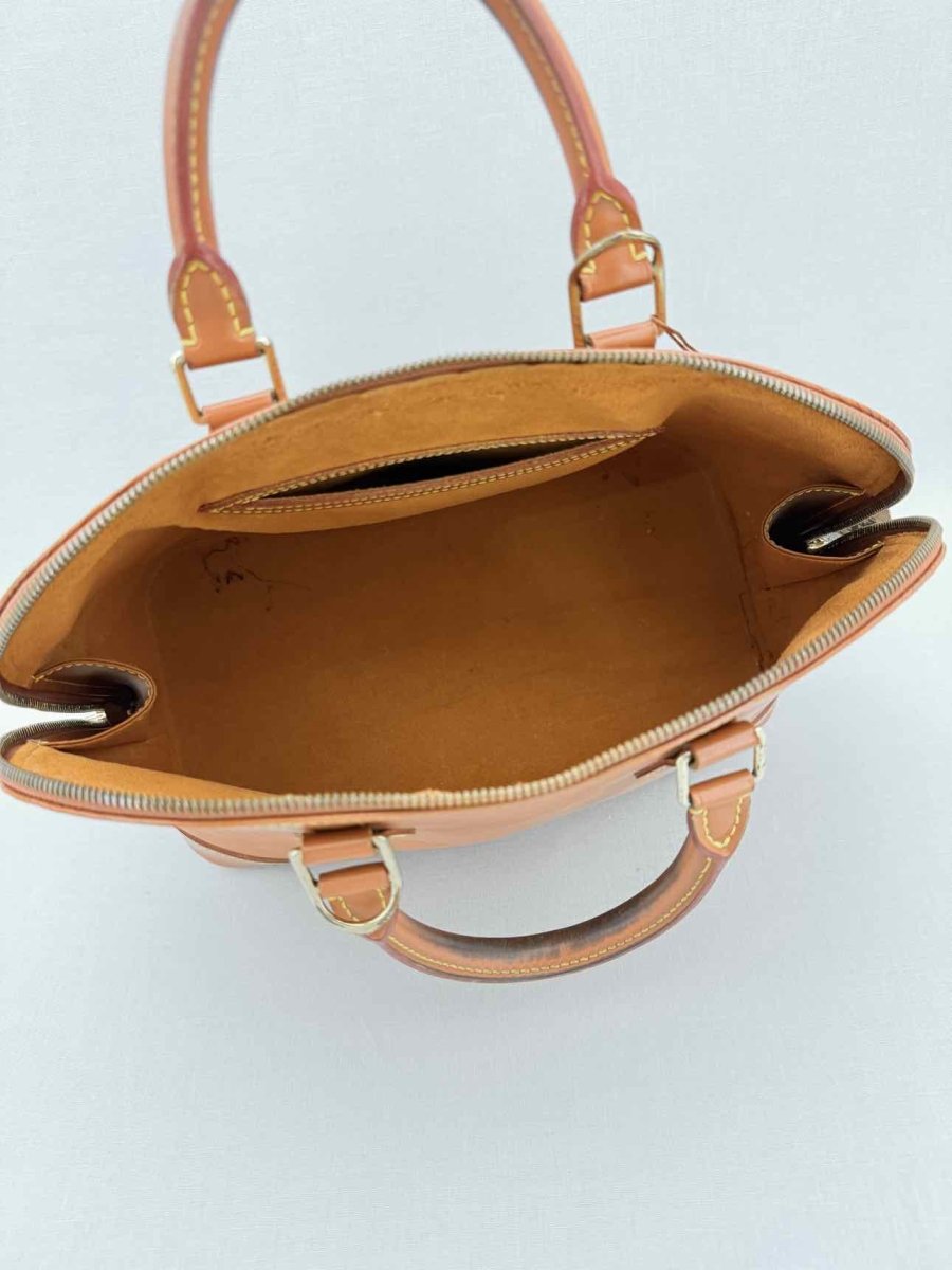 Pre - loved LOUIS VUITTON Alma Camel Top Handle at Reems Closet