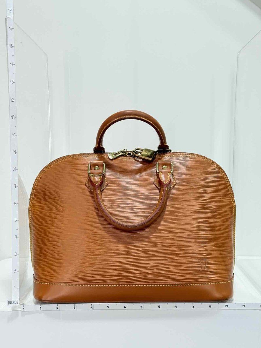 Pre - loved LOUIS VUITTON Alma Camel Top Handle at Reems Closet