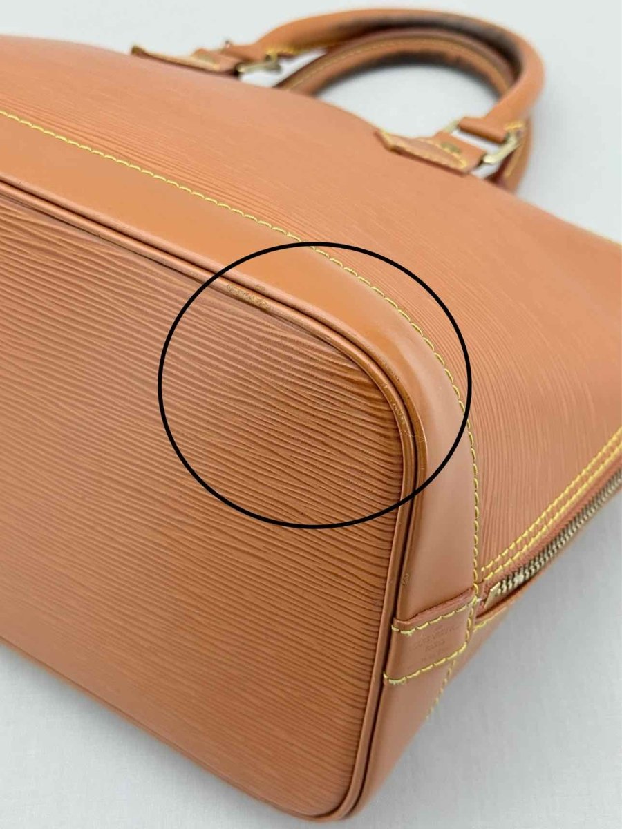 Pre - loved LOUIS VUITTON Alma Camel Top Handle at Reems Closet