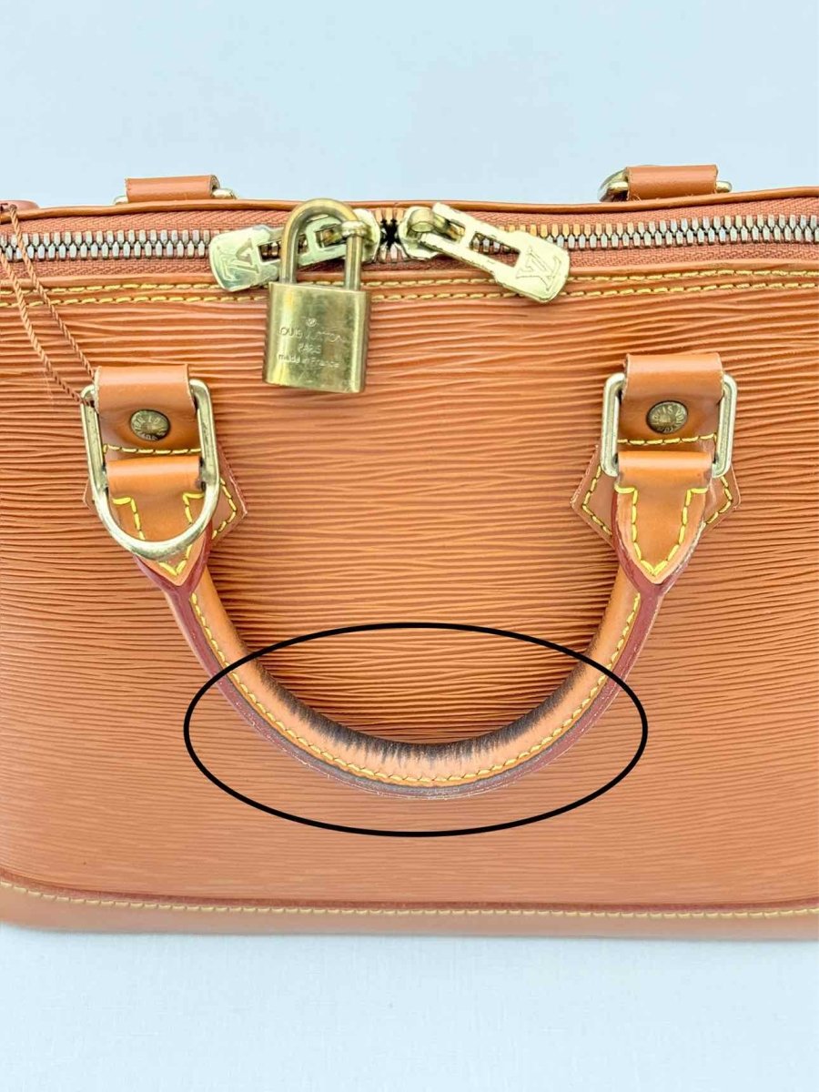 Pre - loved LOUIS VUITTON Alma Camel Top Handle at Reems Closet