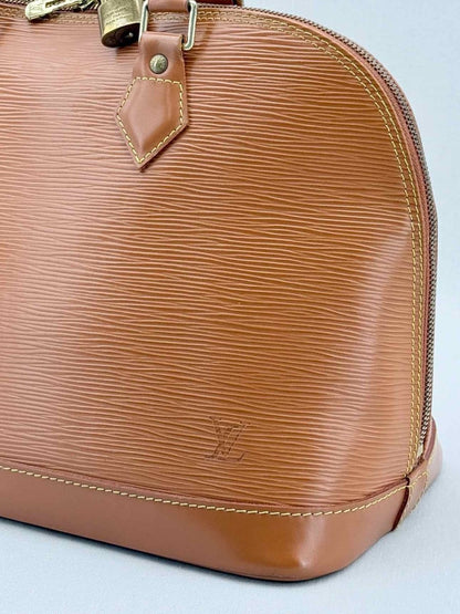 Pre - loved LOUIS VUITTON Alma Camel Top Handle at Reems Closet