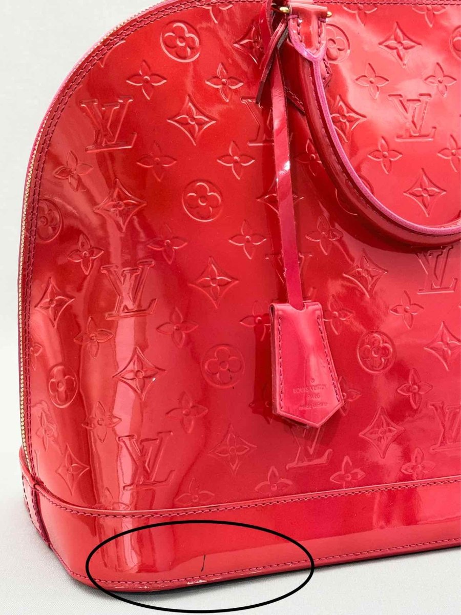 Pre-loved LOUIS VUITTON Alma Red Monogram Top Handle at Reems Closet