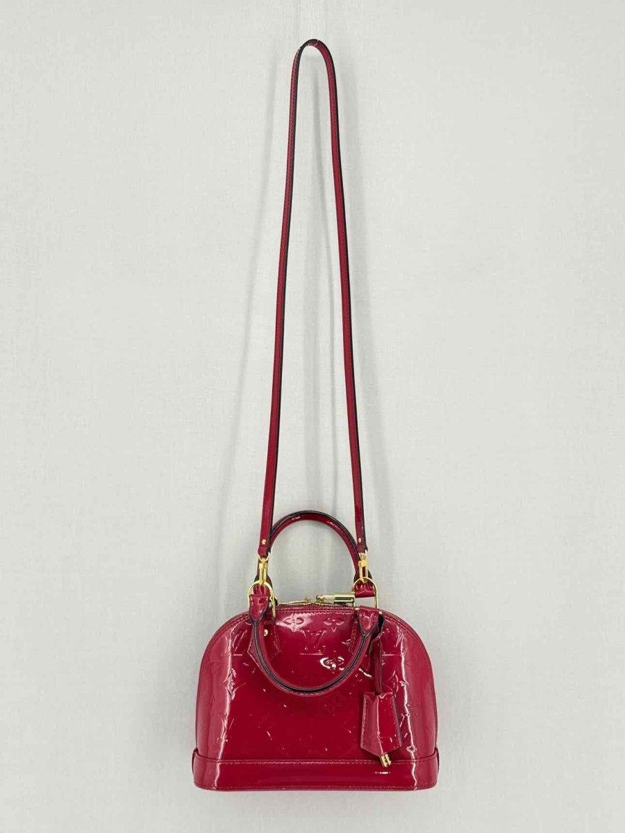Pre-loved LOUIS VUITTON Alma Red Monogram Top Handle at Reems Closet