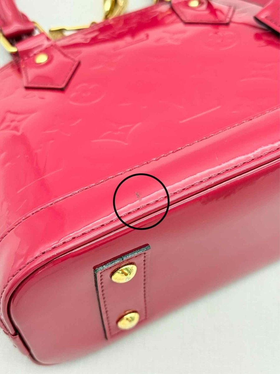 Pre-loved LOUIS VUITTON Alma Red Monogram Top Handle at Reems Closet