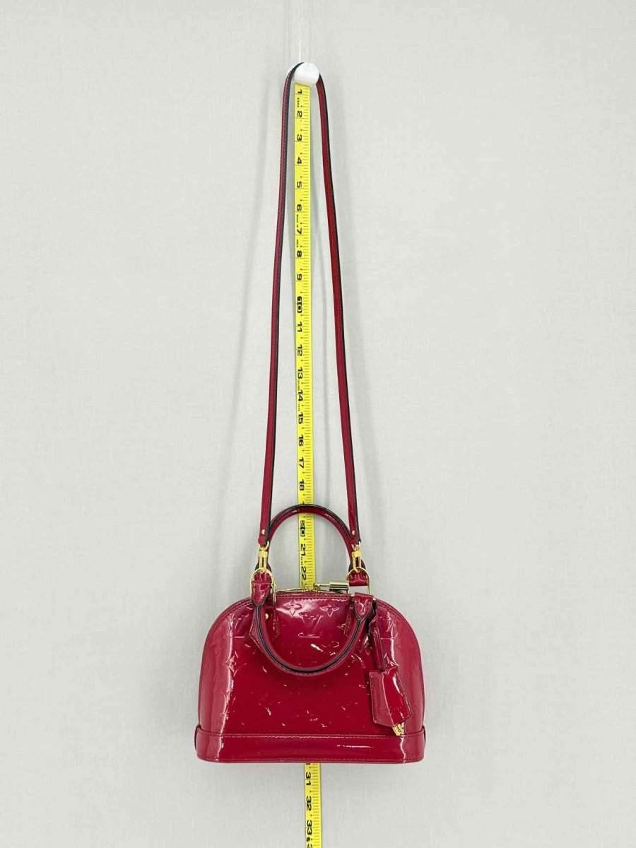 Pre-loved LOUIS VUITTON Alma Red Monogram Top Handle at Reems Closet