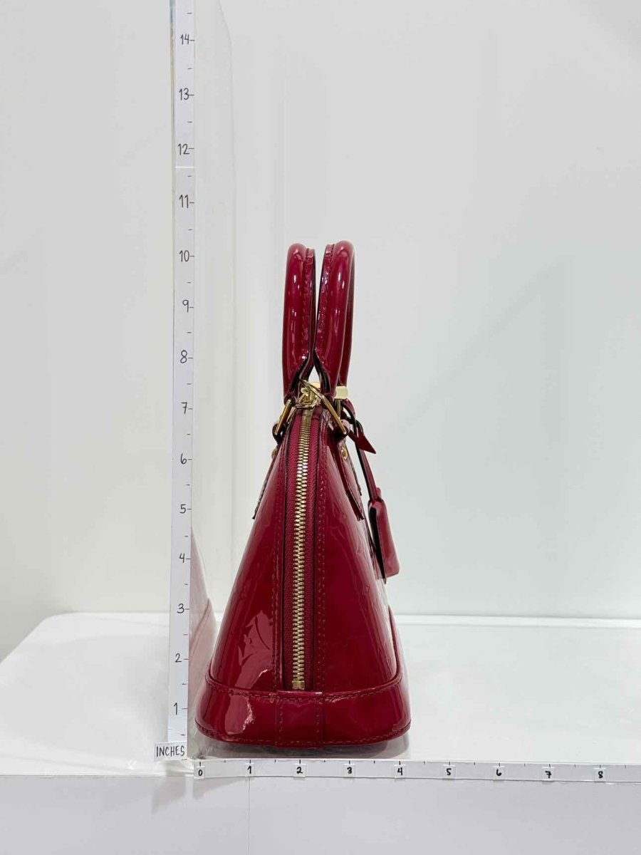 Pre-loved LOUIS VUITTON Alma Red Monogram Top Handle at Reems Closet