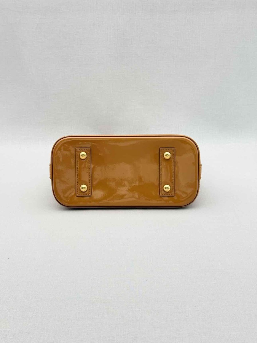 Pre-loved LOUIS VUITTON Alma Tan Monogram Top Handle at Reems Closet