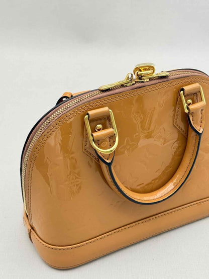 Pre-loved LOUIS VUITTON Alma Tan Monogram Top Handle at Reems Closet