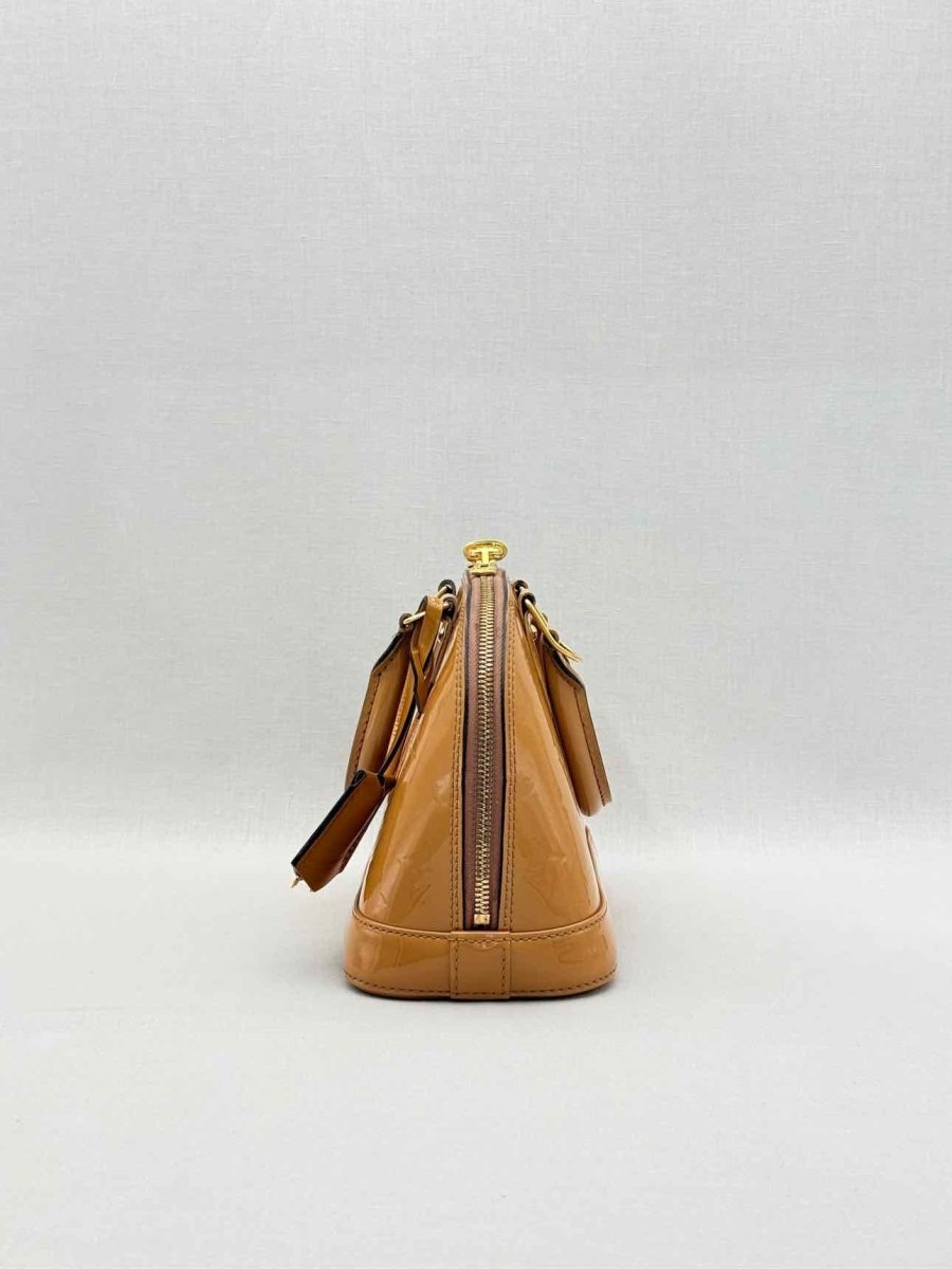 Pre-loved LOUIS VUITTON Alma Tan Monogram Top Handle at Reems Closet