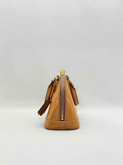 Pre-loved LOUIS VUITTON Alma Tan Monogram Top Handle at Reems Closet