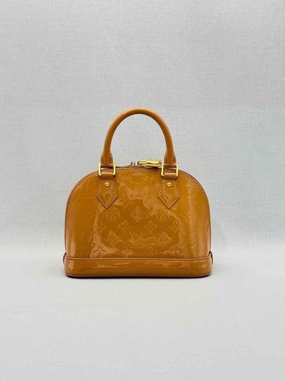 Pre-loved LOUIS VUITTON Alma Tan Monogram Top Handle at Reems Closet