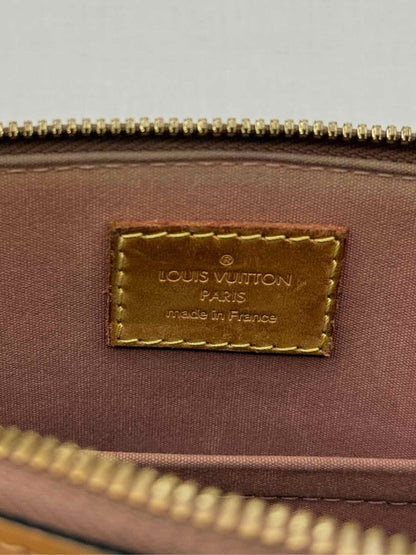 Pre-loved LOUIS VUITTON Alma Tan Monogram Top Handle at Reems Closet